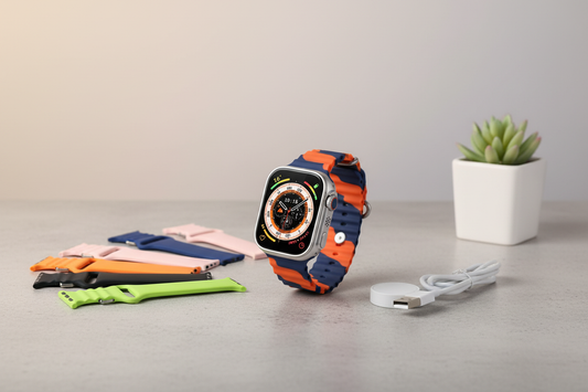 Smartwatch with colorful bands and charger in modern setting